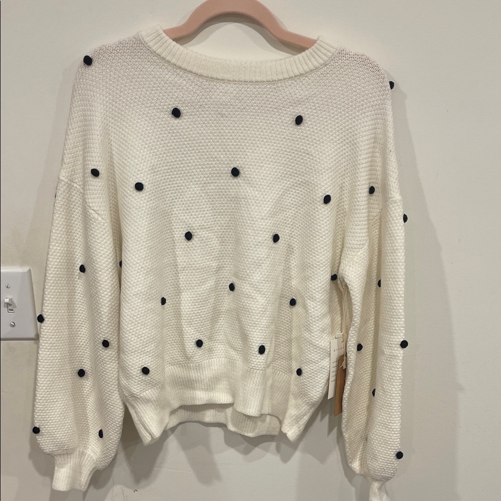 Elegant Cream Sweater with Black Dots
